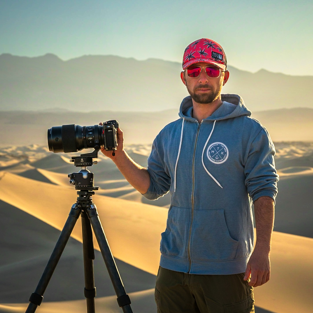 Lawrence — founder of aiPRINT.ai, photographing in the dunes at golden hour