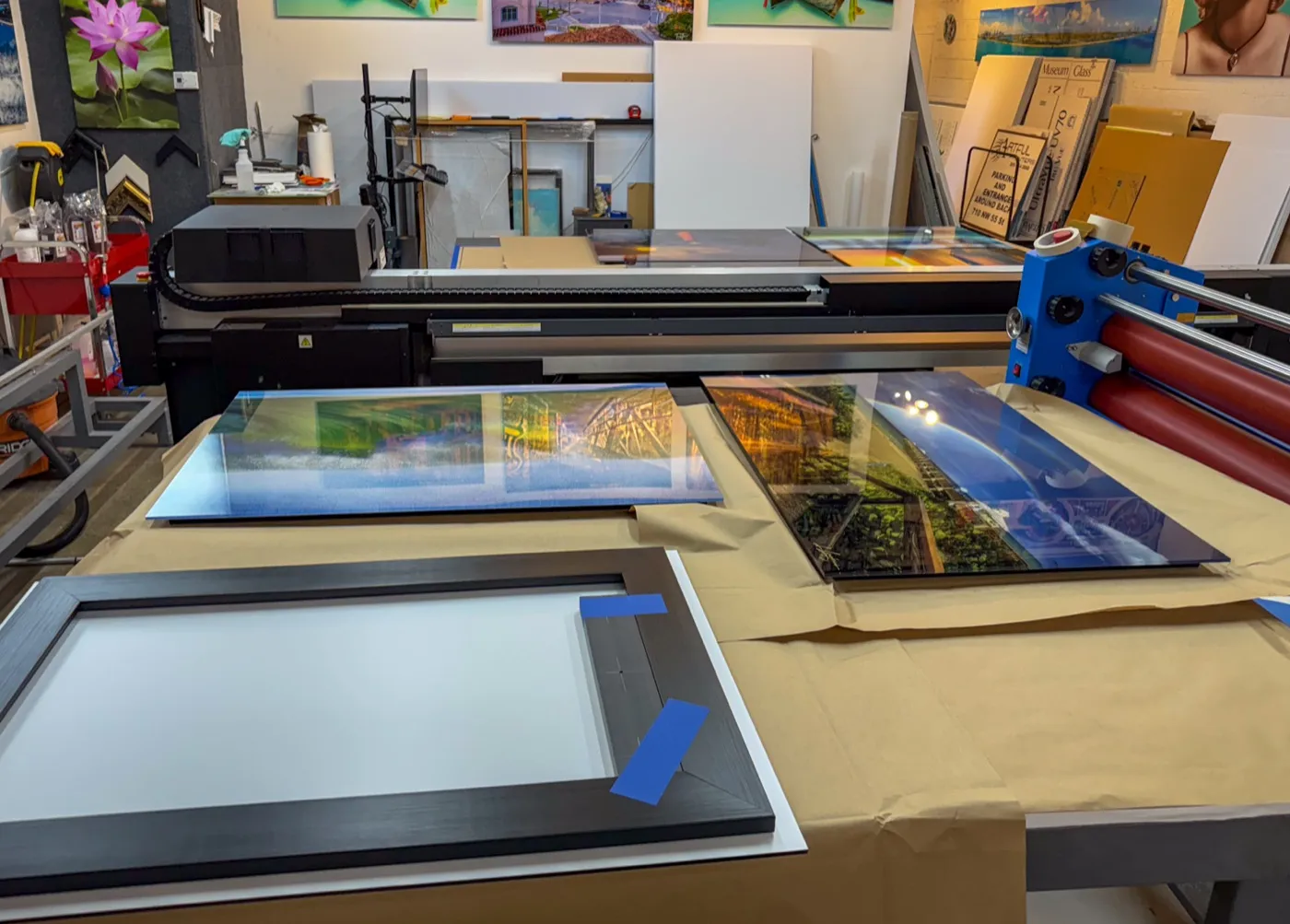 Acrylic prints and a black frame ready for finishing